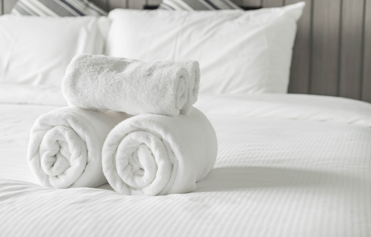 White Towel On Bed Decoration In Bedroom Interior