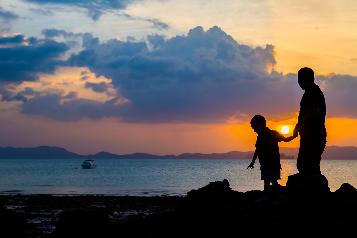 Silhouette Image Of Father And Son At The Beach