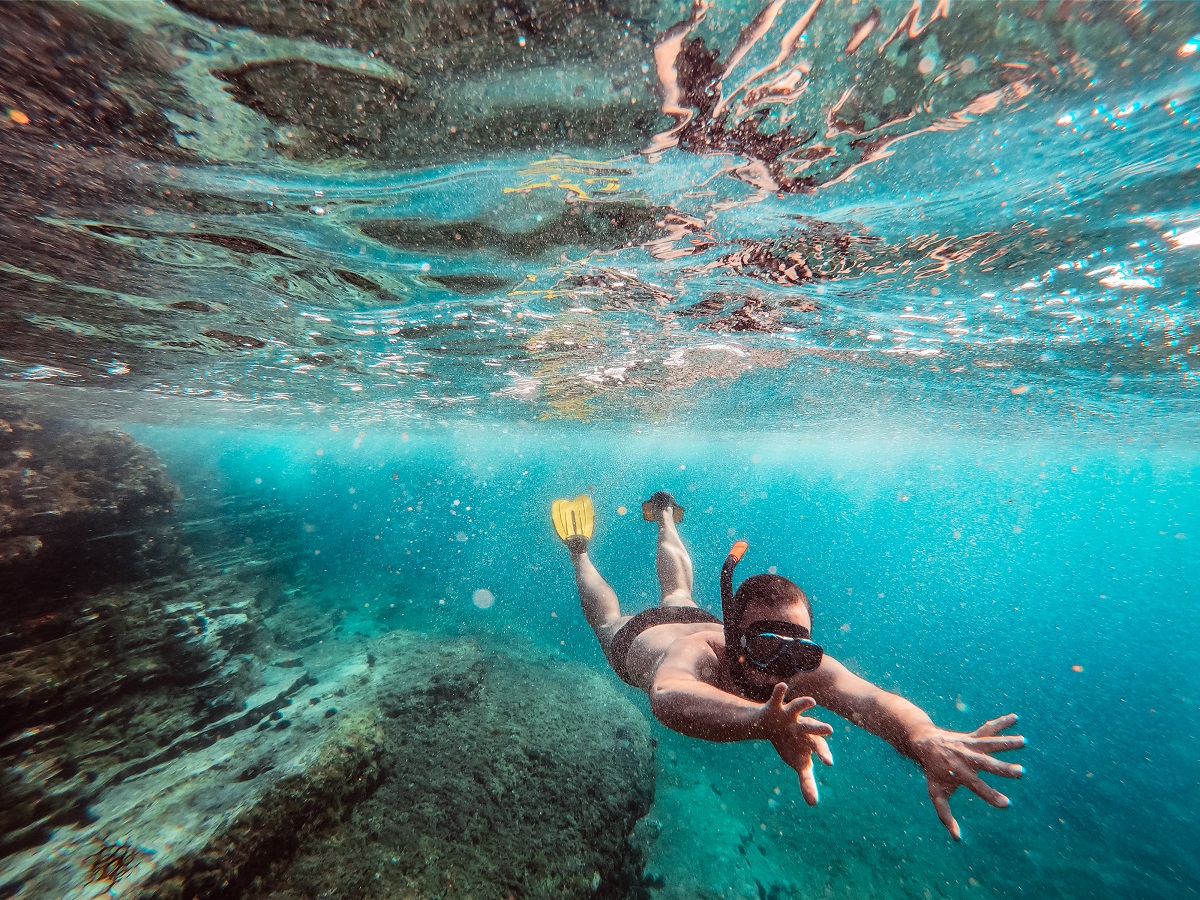 Underwater Photo Of Men Diver Snorkeling In The Sea