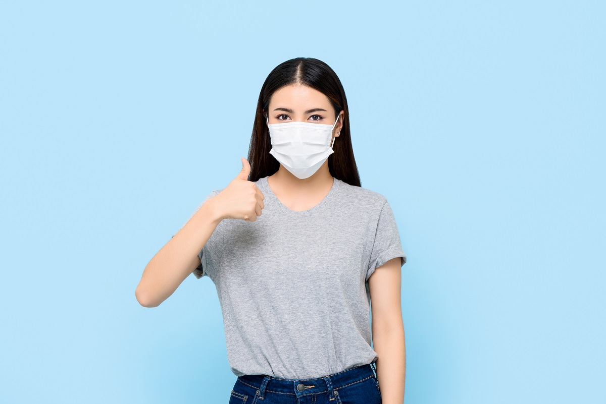 Young Asian Woman Wearing Face Mask Protecting Coronavirus And A